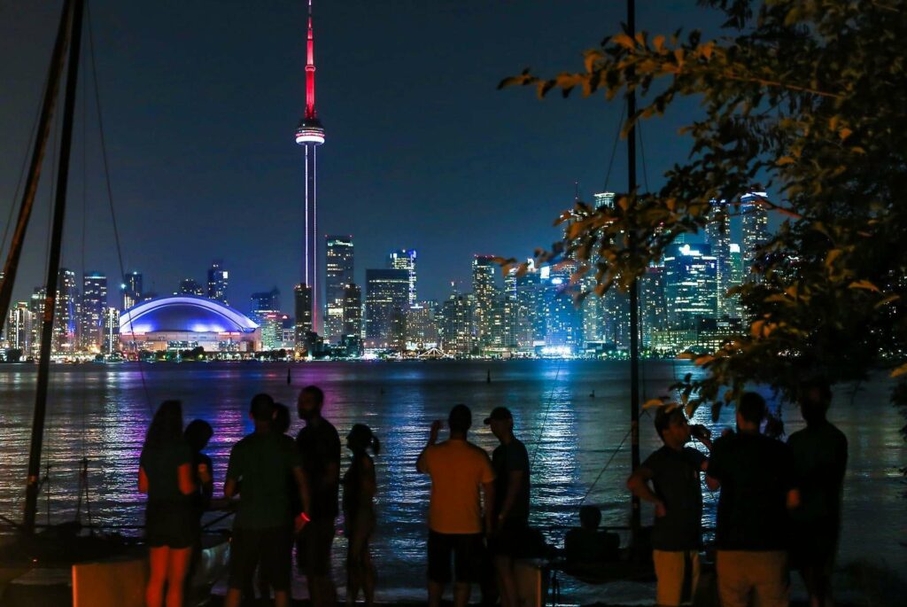 Take in the nighttime cityscape from Toronto Island